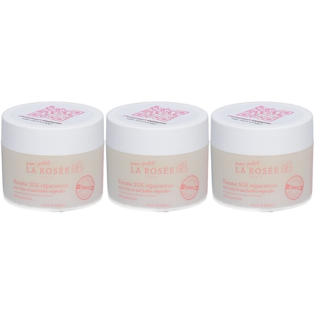 Trois pots de Baume SOS réparateur LA ROSÉE pour bébés. Couvercles blancs, texte rose. Inscription : Baume SOS réparateur. Avec logo.