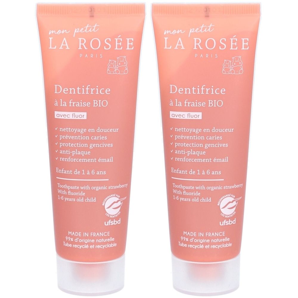 Deux tubes de dentifrice rose pour enfants. Inscription : "LA ROSÉE", "Dentifrice à la fraise BIO". Bouchon blanc. Contient du fluor.