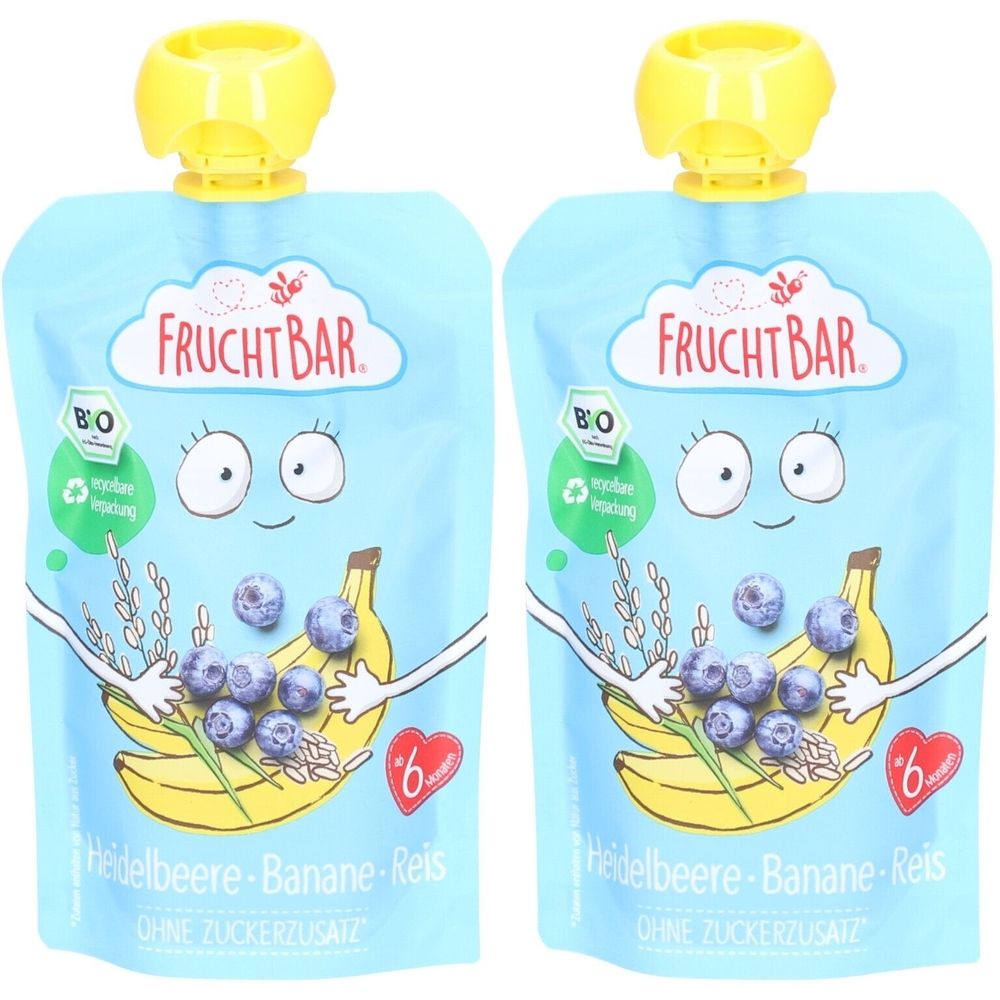 Deux gourdes avec bouchon jaune. Inscription FRUCHTBAR. Illustration de myrtilles, banane et riz. Label bio. Texte : Heidelbeere-Banane-Reis, sans sucre ajouté.