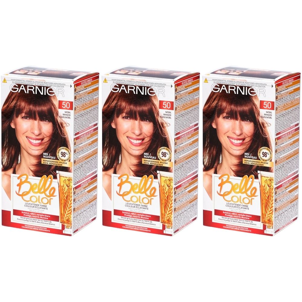 Trois boîtes de coloration Garnier Belle Color. Chaque boîte présente une femme aux cheveux bruns. Texte: 5.5 Acajou.
