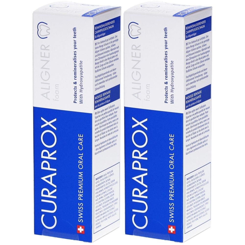 Deux boîtes blanches avec texte bleu. Inscription: CURAPROX, ALIGNER foam, Swiss Premium Oral Care. Texte: Protège & reminéralise vos dents.