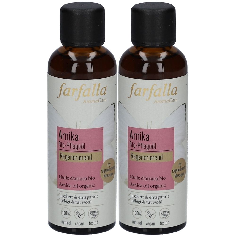 Zwei Flaschen Farfalla Arnika Bio-Pflegeöl. Braune Glasflaschen mit schwarzem Deckel und Etikett mit Produktinformationen und Logos.