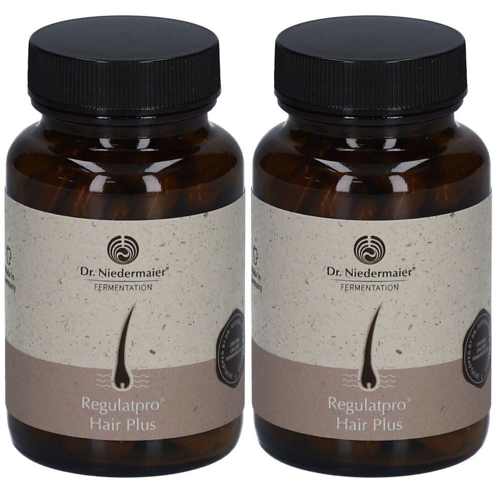 Deux flacons bruns avec des bouchons noirs. Les étiquettes indiquent "Dr. Niedermeier Fermentation" et "Regulatpro Hair Plus".
