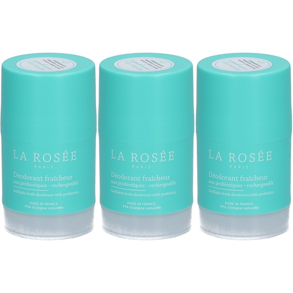 Trois déodorants rechargeables cylindriques turquoise. Inscription: LA ROSÉE, Déodorant fraîcheur aux probiotiques. Base blanche.