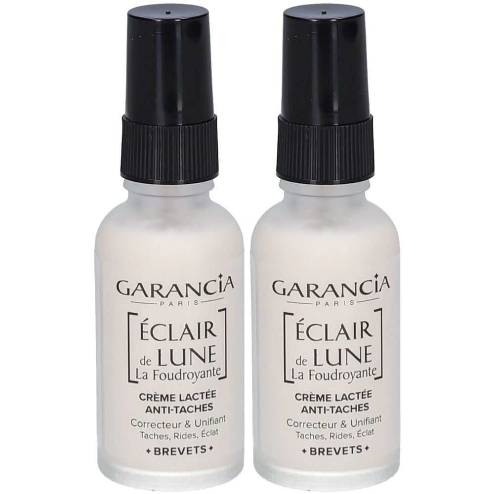 Zwei Flaschen mit schwarzem Sprühkopf. Aufschrift: GARANCIA PARIS, ÉCLAIR de LUNE, La Foudroyante, Crème Lactée Anti-Taches.