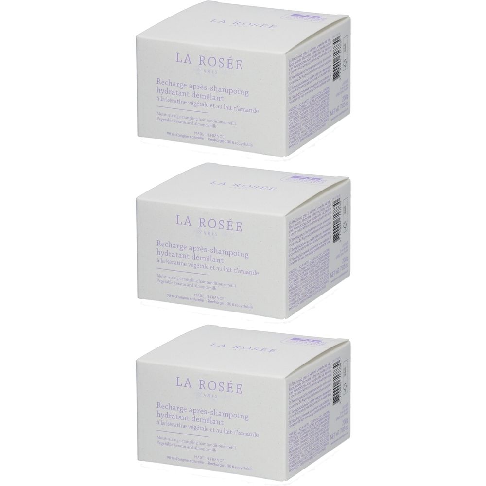 Trois boîtes carrées. Inscription: LA ROSÉE. Texte: Recharge après-shampooing hydratant démêlant. Couleurs: blanc, violet.