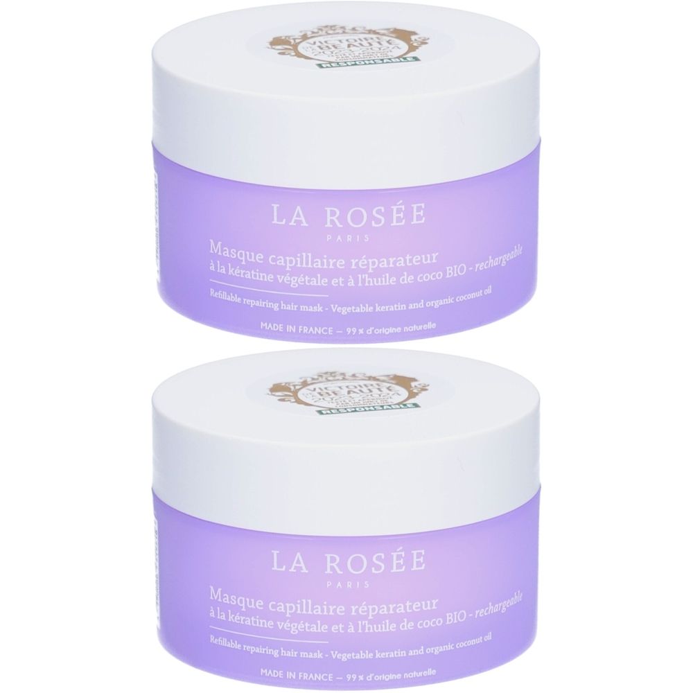 Deux pots violets avec couvercles blancs. Inscription: LA ROSÉE PARIS, Masque capillaire réparateur. Texte en français.