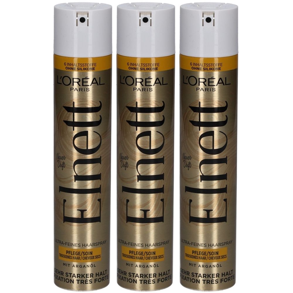 Drei Haarspray-Dosen. Weiß-goldene Verpackung. Aufschrift: Elnett, L'Oréal Paris. Für trockenes Haar. Sehr starker Halt.