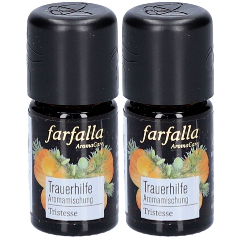 Deux petites bouteilles avec bouchons noirs. Étiquettes : "farfalla", "Trauerhilfe Aromamischung" et "Tristesse".