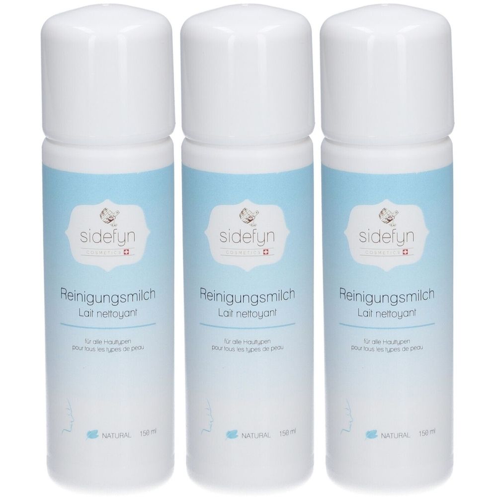 Trois flacons blancs avec étiquette bleue. Inscription: sidefyn Reinigungsmilch, Lait nettoyant. Pour tous types de peaux. NATURAL.