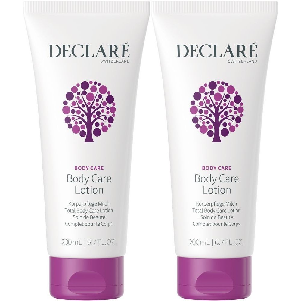 Deux tubes de lotion pour le corps DECLARÉ. Tubes blancs avec accents violets et logo. Texte: Body Care Lotion, 200ml.