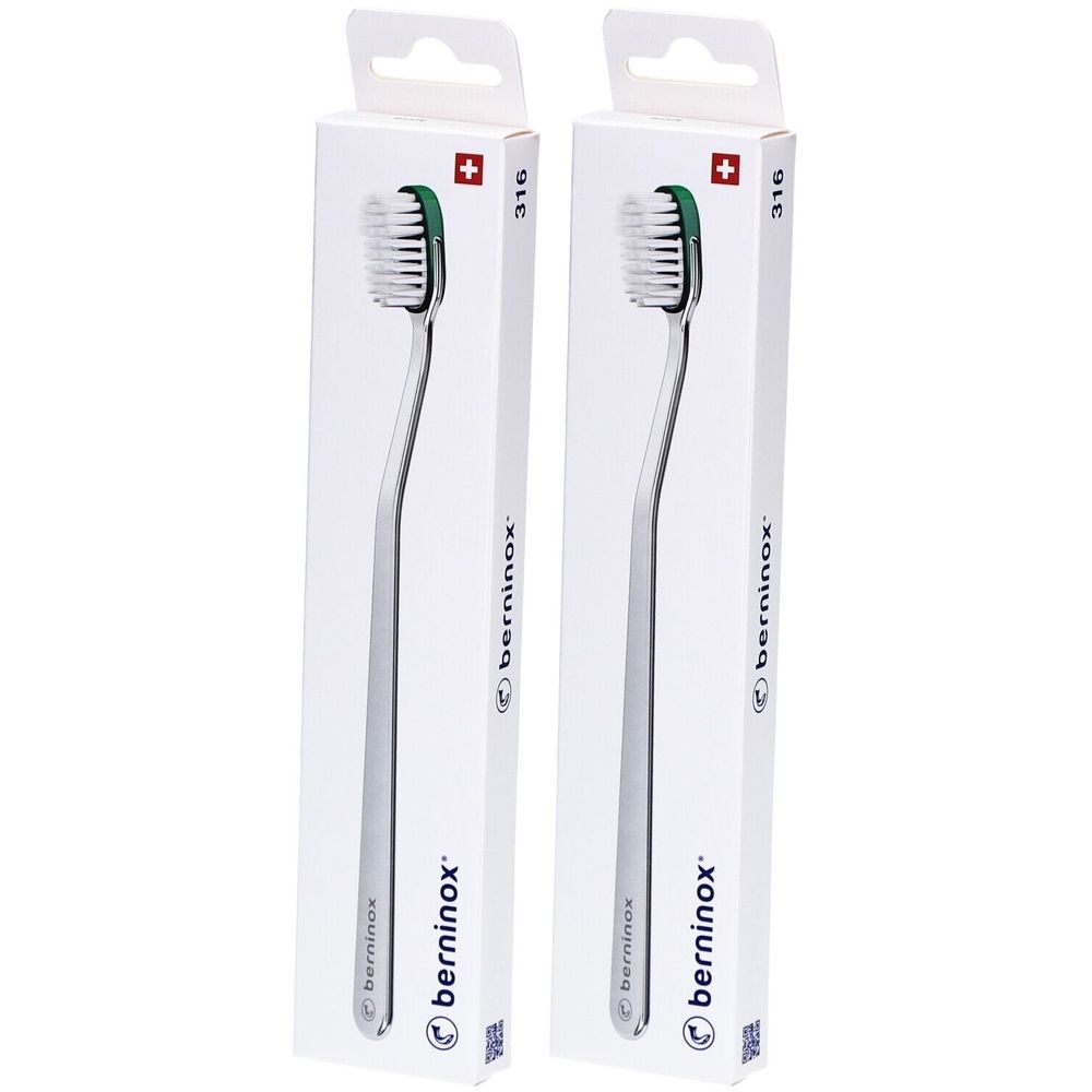 Deux brosses à dents dans des emballages blancs. Les brosses ont un manche argenté et une tête verte. Le nom "berninox" est visible.