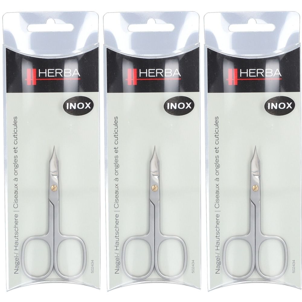 Trois ciseaux à ongles HERBA INOX dans leur emballage. Ciseaux en métal, poignées arrondies, pointe fine. Emballage avec trou de suspension.