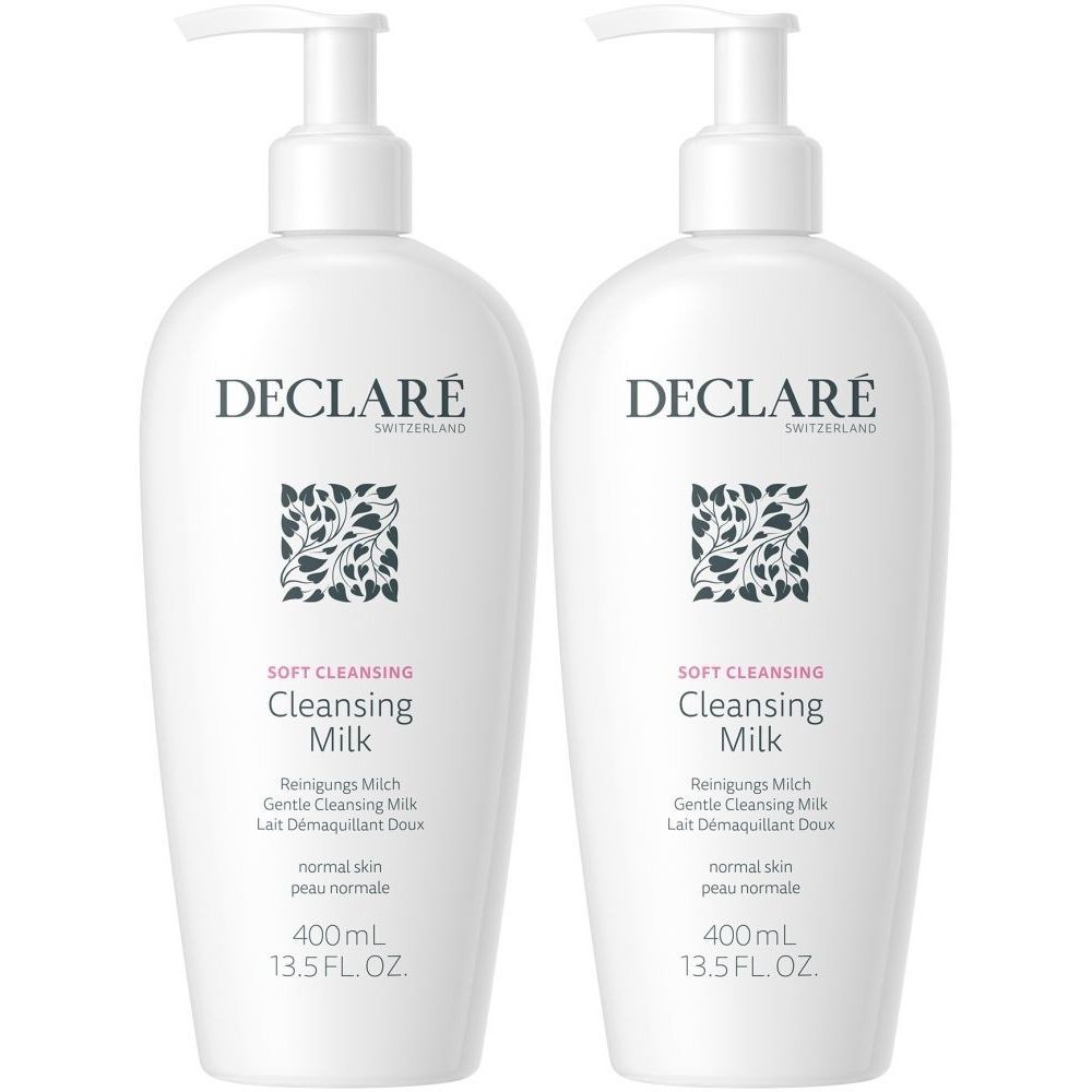 Deux flacons blancs de DECLARÉ Cleansing Milk avec pompe. Inscription: Cleansing Milk, 400ml, pour peau normale.