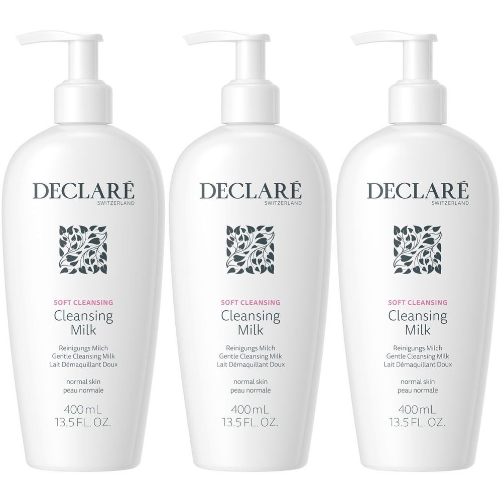 Trois flacons blancs avec pompe. Chaque flacon porte l'inscription DECLARÉ, Cleansing Milk, 400ml.