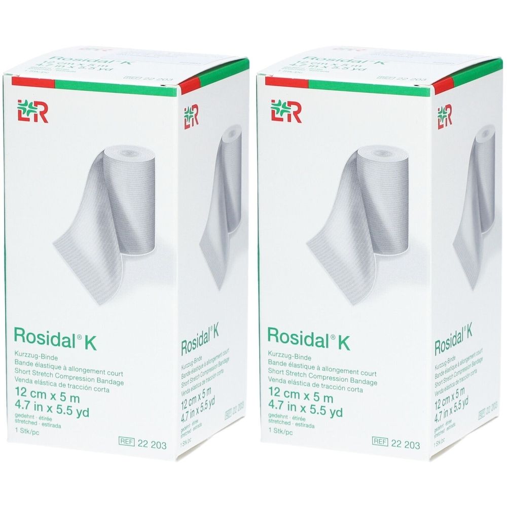 Deux boîtes de Rosidal® K. Inscription : 12 cm x 5 m. Bande de compression courte. Matériau de bandage blanc en rouleau, partiellement déroulé.