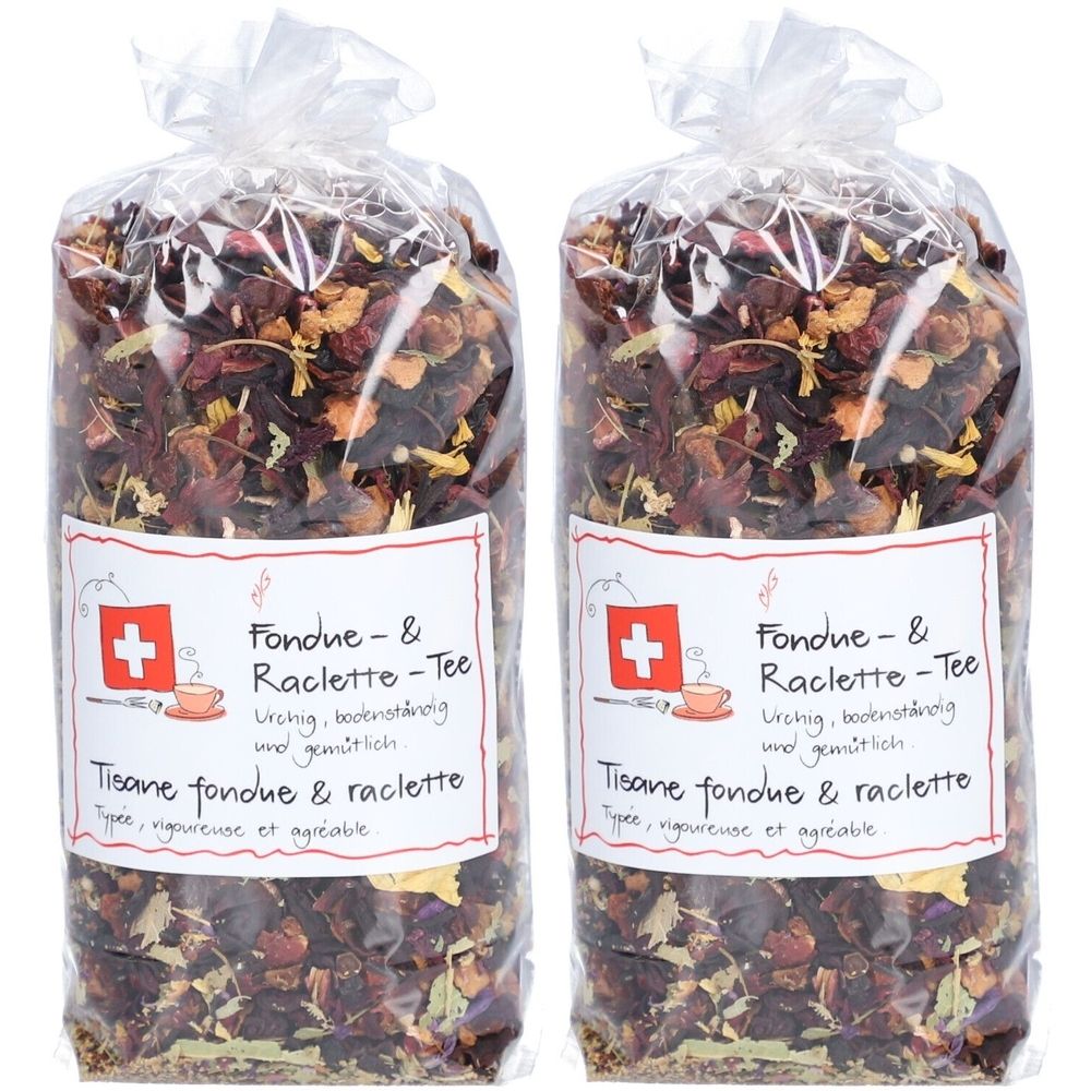 Deux sachets de thé avec l'inscription "Fondue & Raclette-Tee". Croix suisse et texte en allemand et français. Emballage transparent.