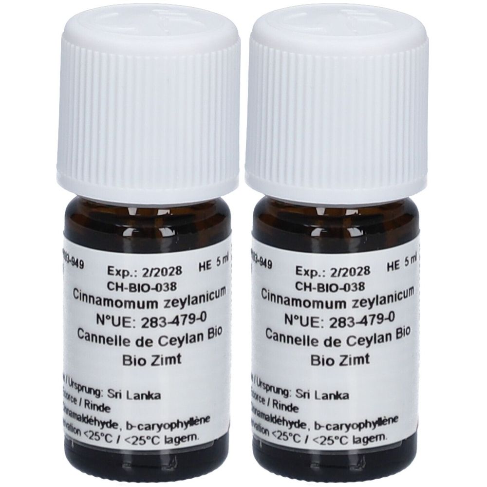 Deux flacons en verre brun avec bouchons blancs. Étiquettes avec texte: Cinnamomum zeylanicum, Bio Zimt. Date de péremption 2/2028.