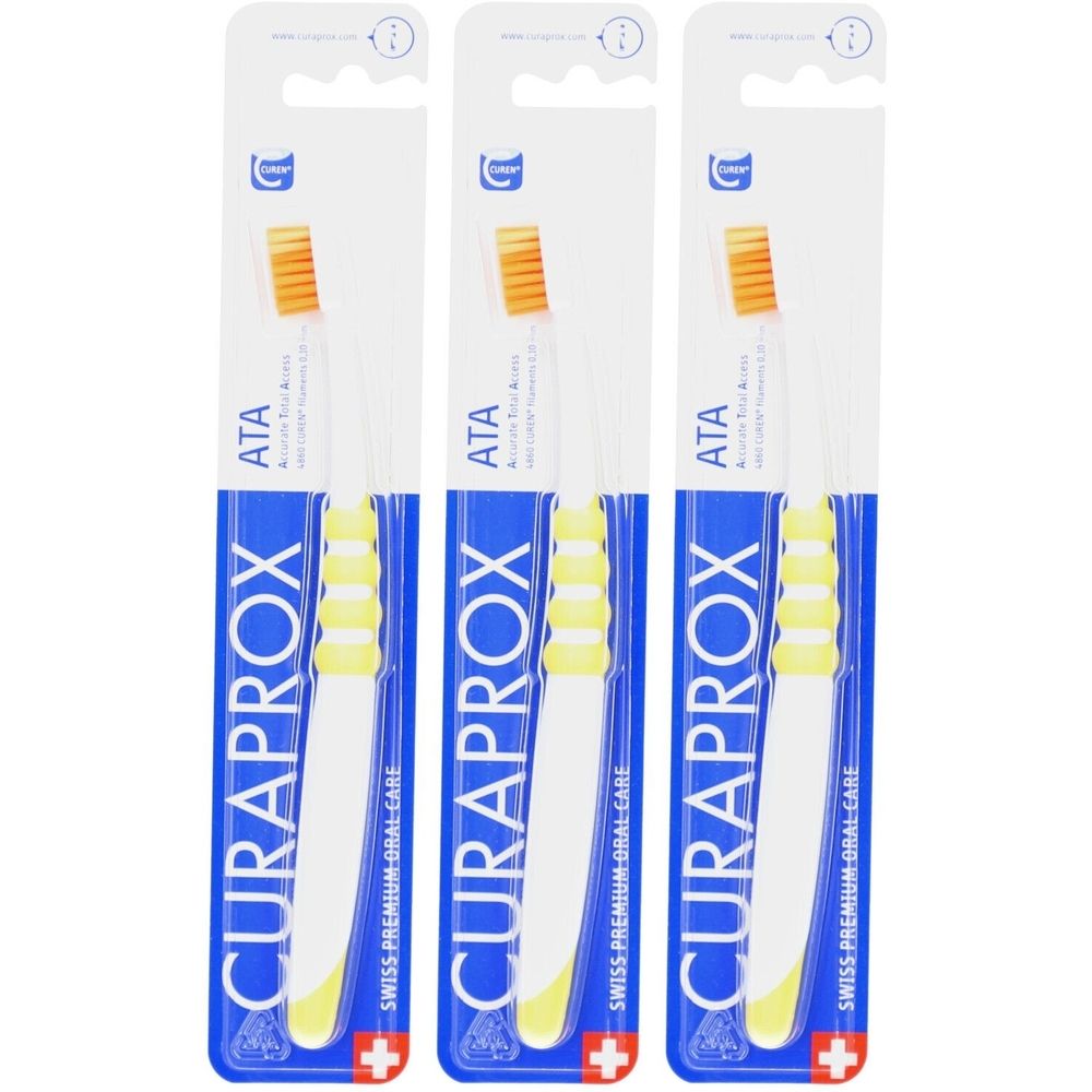 Trois brosses à dents emballées. Emballage bleu, manche blanc, tête jaune. Marque : Curaprox.