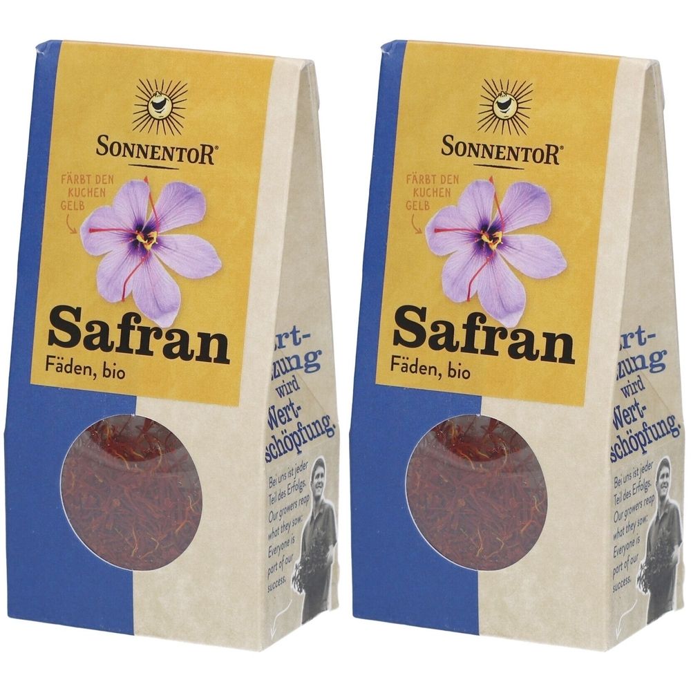 Zwei Beutel Safranfäden, bio. Auf gelbem Hintergrund Logo und Schriftzug. Sichtfenster zeigt das Produkt. Blaue und beige Elemente.