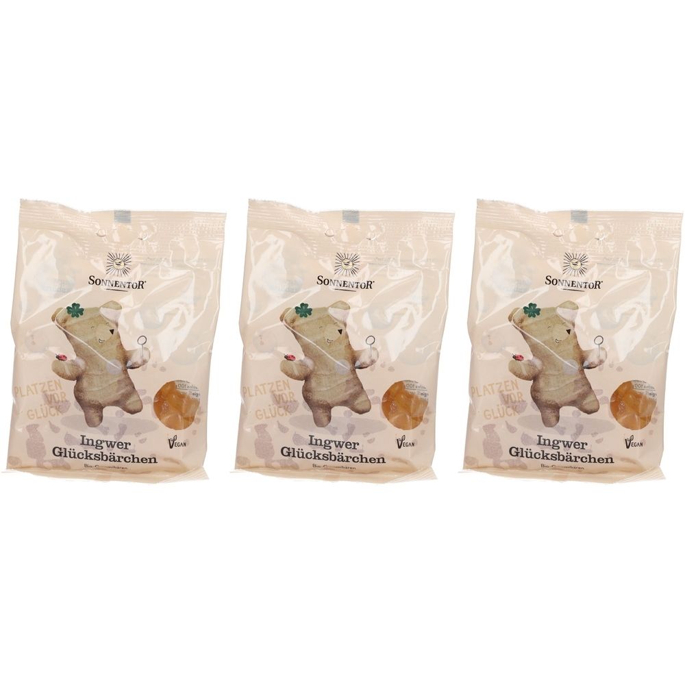Drei Beutel mit Bonbons. Aufdruck: Ingwer Glücksbärchen, Vegan. Marke: SONNENTOR. Abbildung eines Bären mit Kleeblatt.