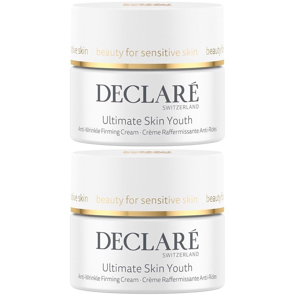 Deux pots blancs avec couvercles. Inscription: DECLARÉ, Ultimate Skin Youth, Anti-Wrinkle Firming Cream. Anneau doré.