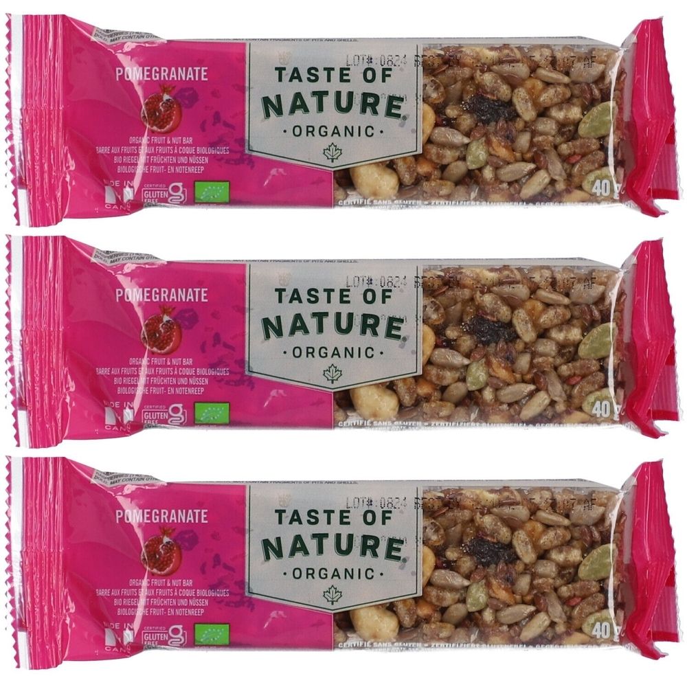 Trois barres de céréales emballées en rose. Inscription : Pomegranate, Taste of Nature Organic. Graines et fruits visibles. Avec label bio.