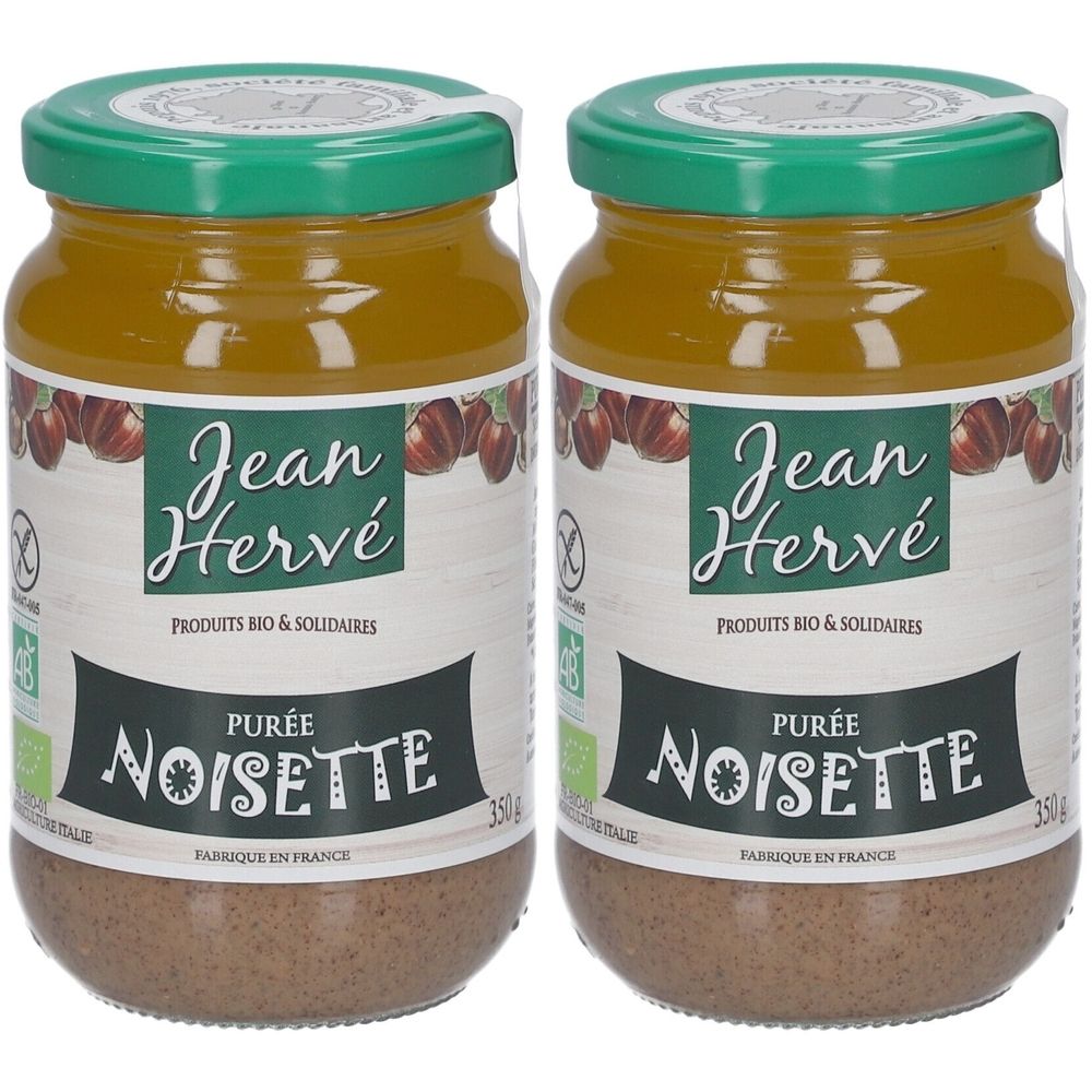 Zwei Gläser Haselnusspüree. Glas mit grünem Deckel und Etikett mit Aufschrift "Jean Hervé Purée Noisette". Bio-Zertifizierung.