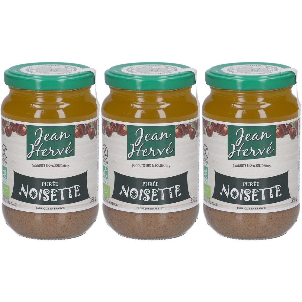 Trois pots de purée de noisettes. Couvercle vert, étiquette blanche avec logo et texte "NOISETTE".
