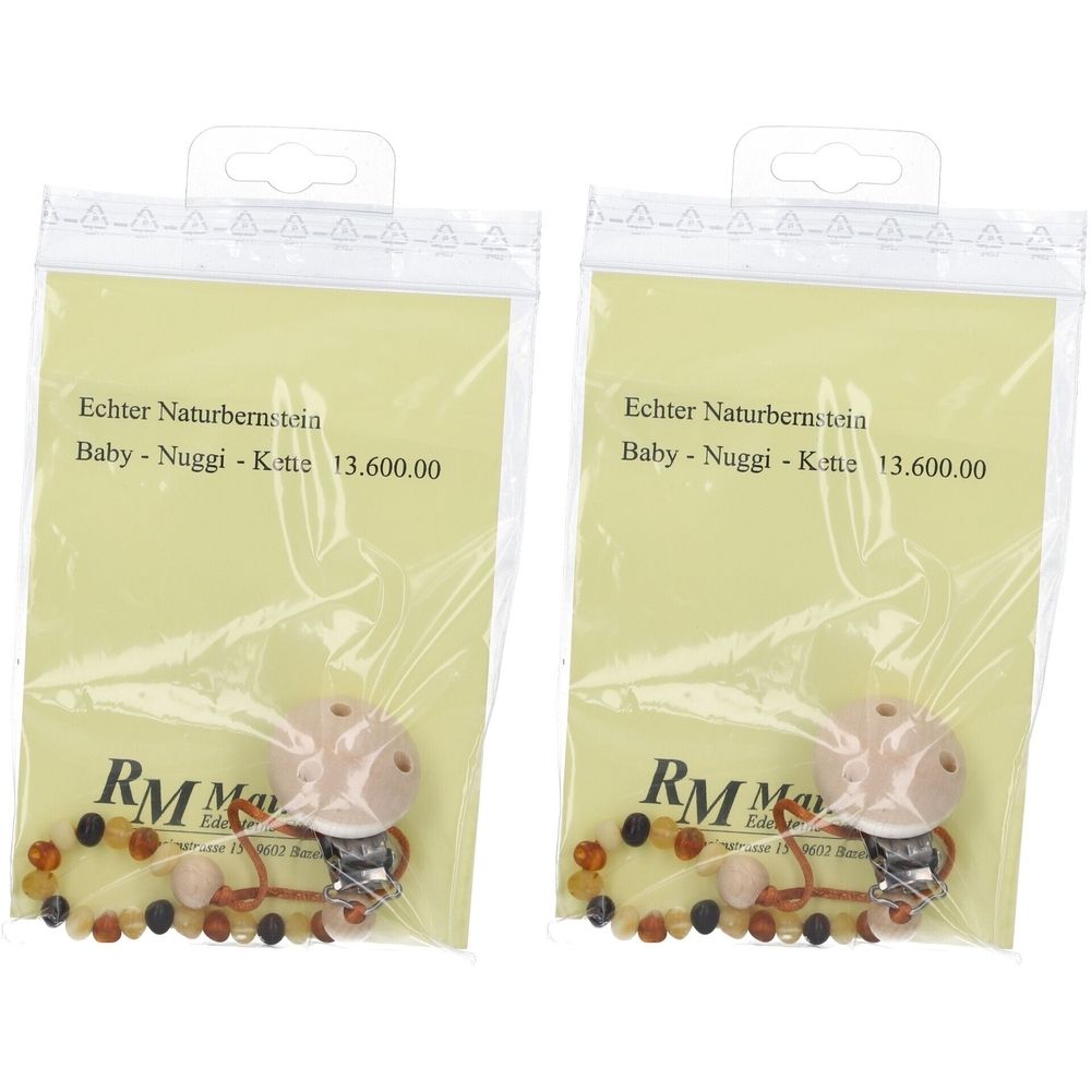 Zwei Schnullerketten mit Bernstein in Plastikverpackung. Auf der Verpackung steht "Echter Naturbernstein" und "Baby-Nuggi-Kette".