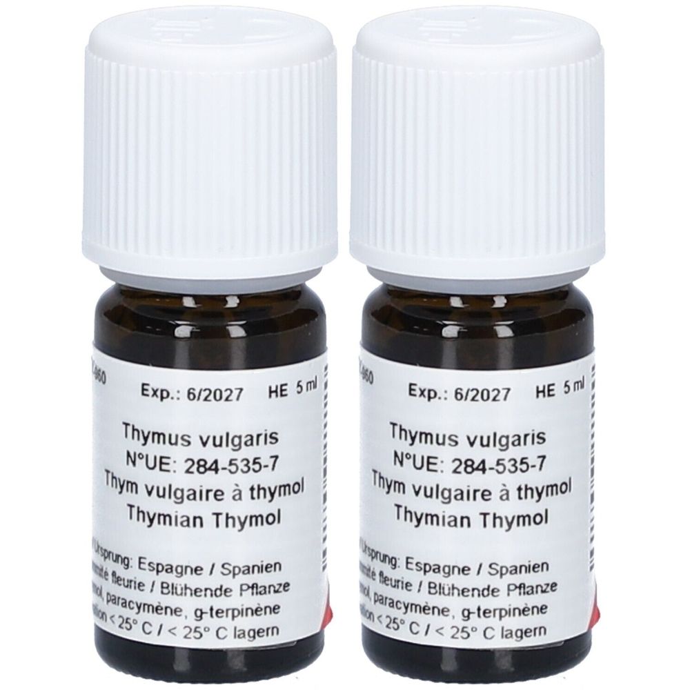 Deux flacons en verre brun avec bouchons blancs. Étiquettes avec texte: Thymus vulgaris, Thymian Thymol. Expiration 6/2027.