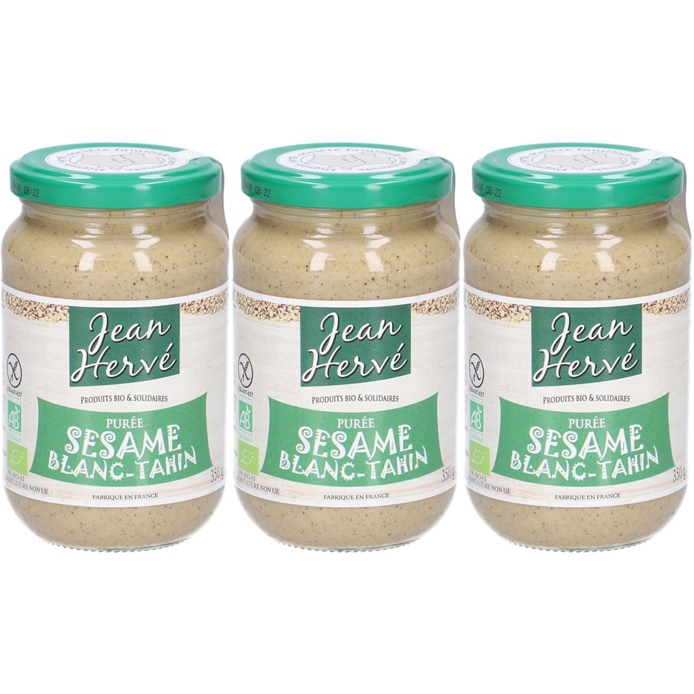 Trois pots de tahin. Pot en verre avec couvercle vert et étiquette. Inscription : Jean Hervé, Purée Sesame Blanc-Tahin, Bio.