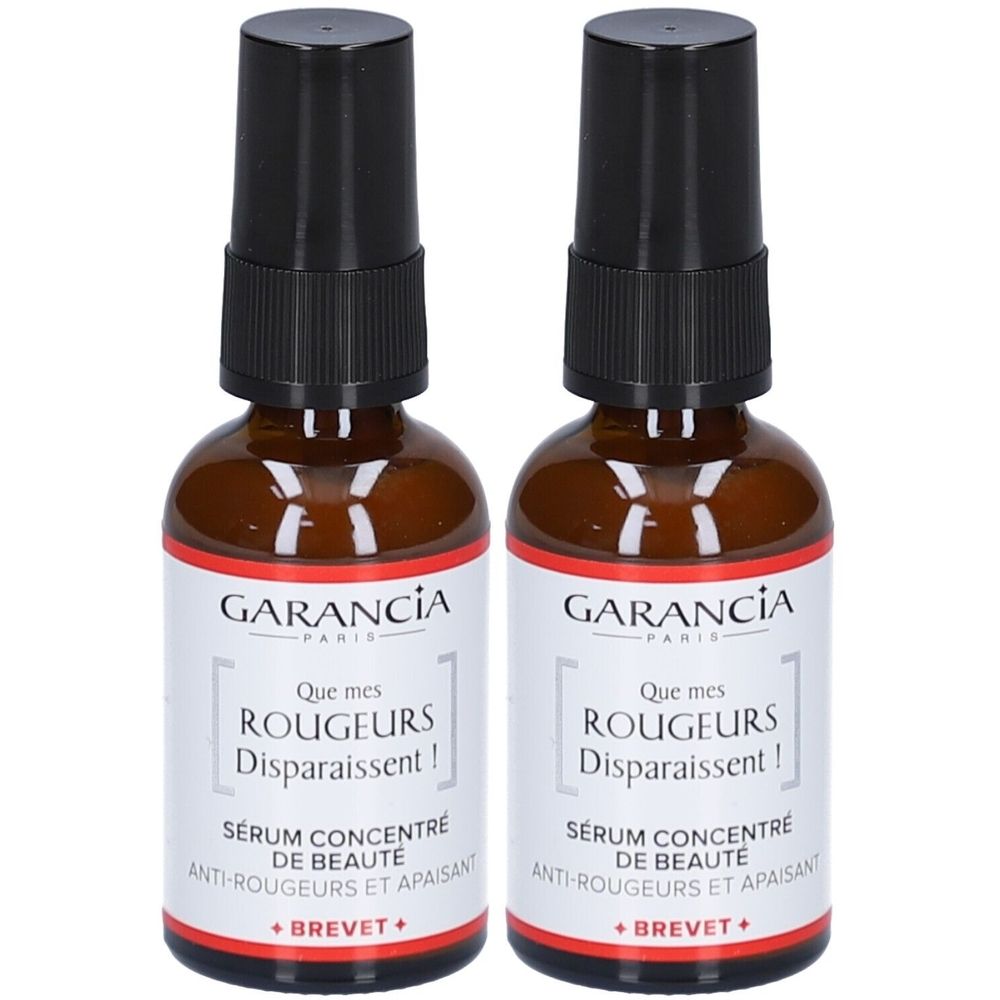 Deux flacons de sérum. Verre brun, bouchon noir. Inscription: GARANCIA, Que mes Rougeurs Disparaissent!, Sérum concentré de beauté.