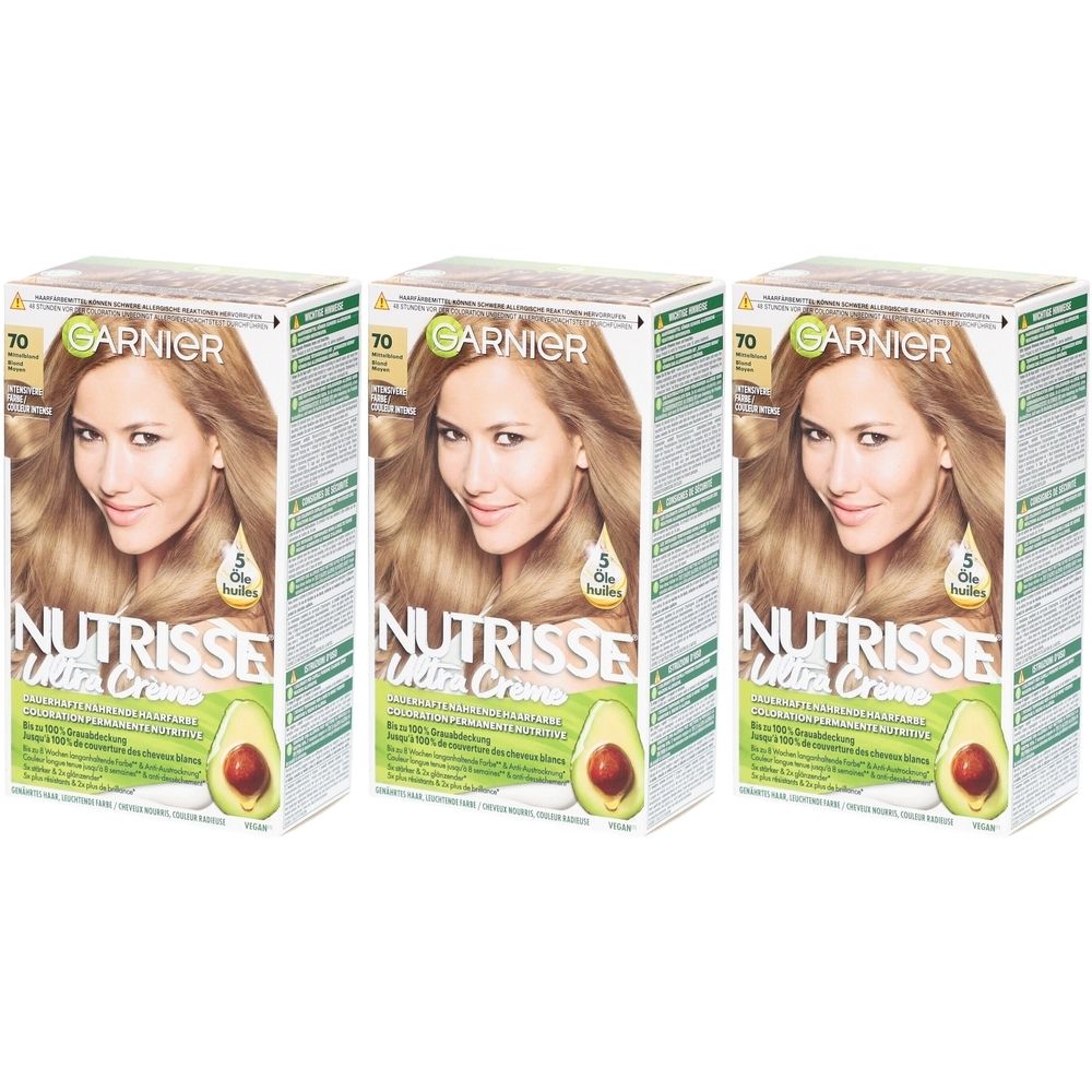 Trois boîtes de coloration capillaire Garnier Nutrisse. Chaque boîte présente une femme blonde. Texte : 70 Blond moyen.