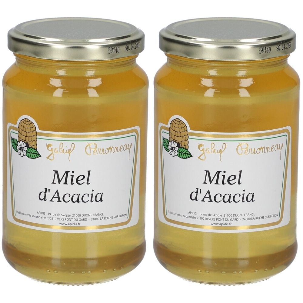 Deux pots de miel avec des couvercles argentés. L'étiquette indique "Miel d'Acacia".