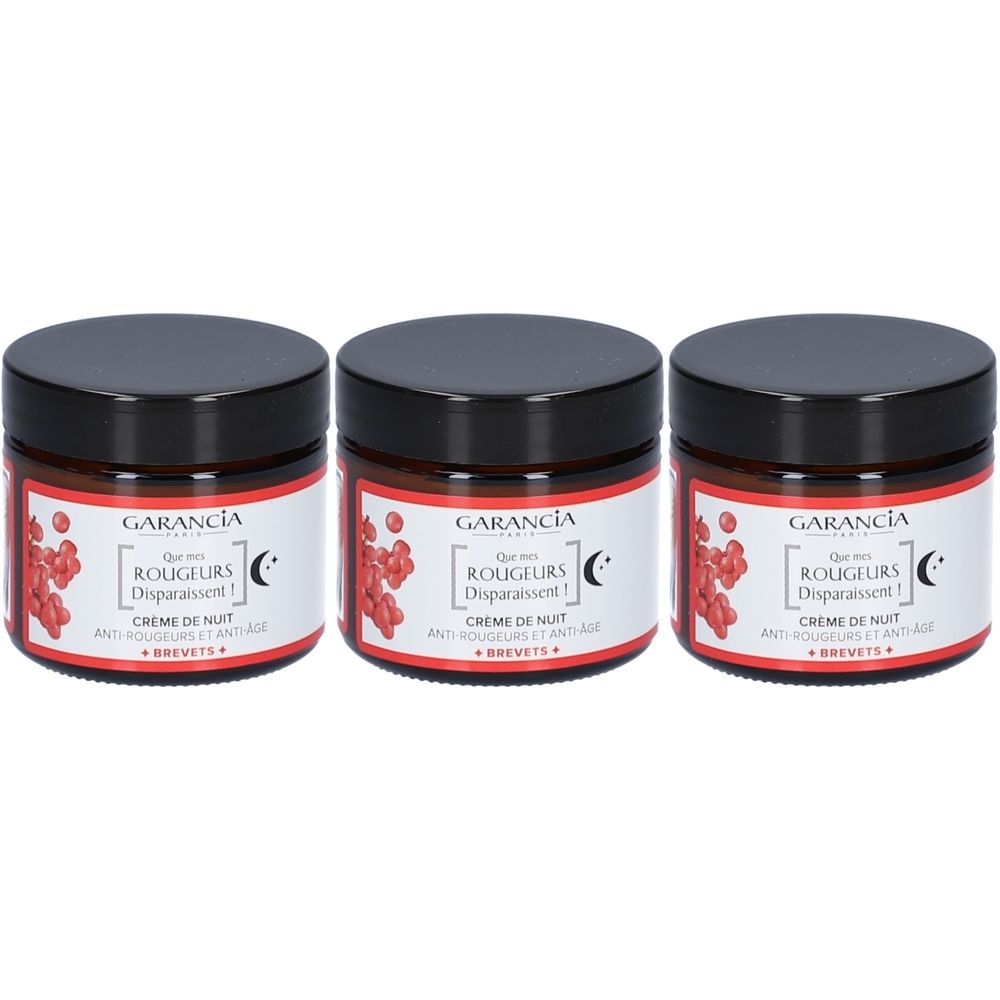 Drei Tiegel Nachtcreme. Schwarze Deckel, braune Gläser, Etikett mit Text und roten Illustrationen. Marke: GARANCIA.