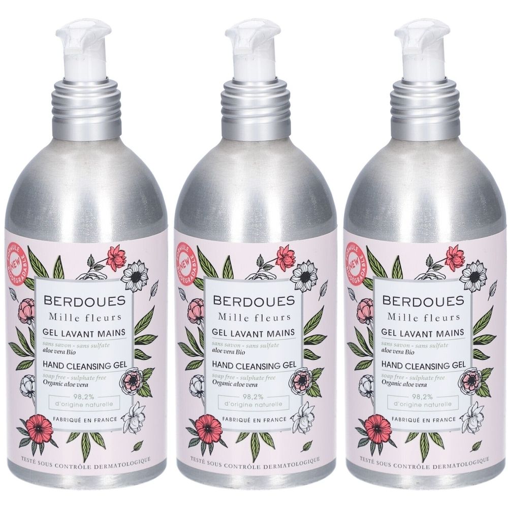 Trois flacons de gel lavant pour les mains. Flacons métalliques avec étiquette rose et motif floral. Texte : Berdoues, Mille Fleurs, Gel Lavant Mains.