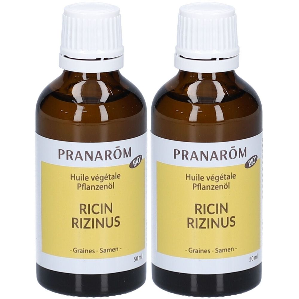 Zwei braune Glasflaschen mit weißem Deckel. Auf gelbem Etikett steht "PRANAROM", "RICIN RIZINUS" und "BIO".