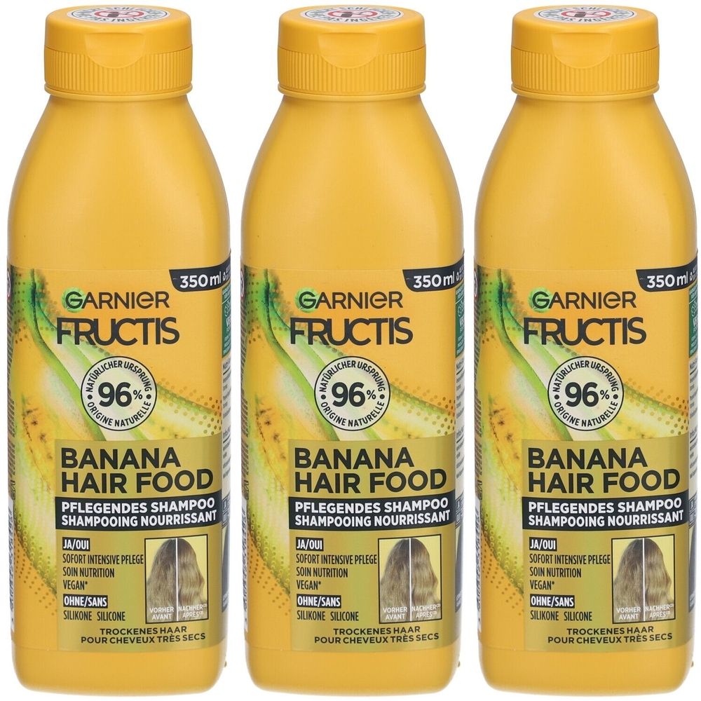 Trois flacons de shampooing jaunes. Chaque flacon porte l'inscription "GARNIER FRUCTIS BANANA HAIR FOOD" et "96% origine naturelle".