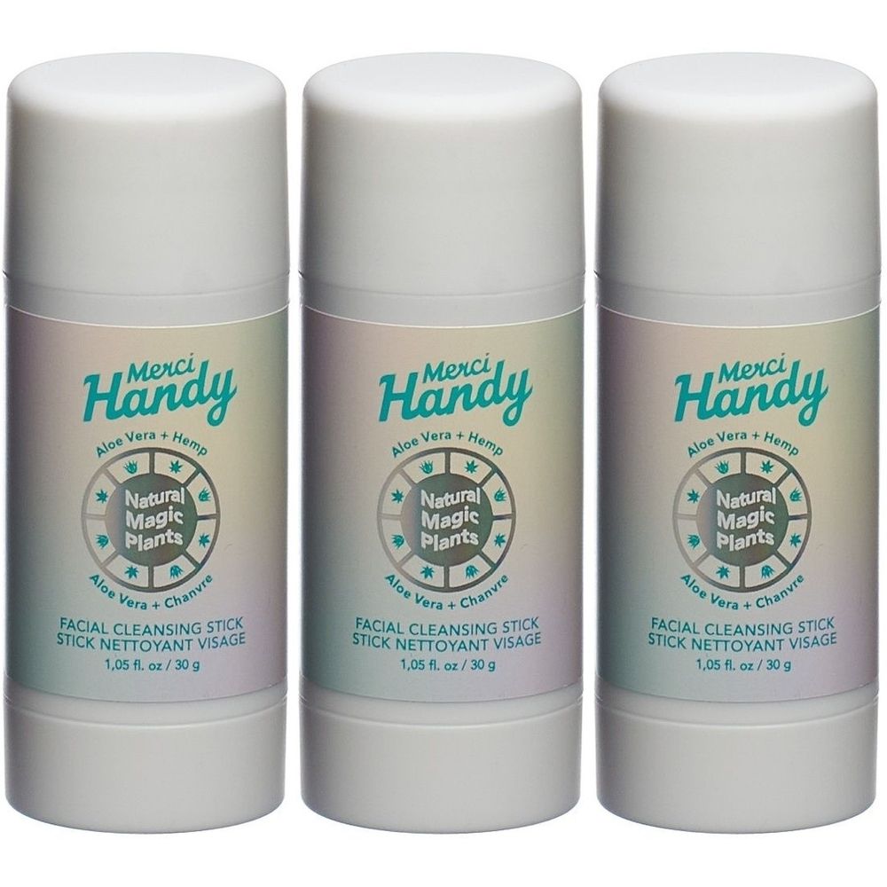 Trois sticks cylindriques blancs. Inscription: Merci Handy, Natural Magic Plants, Facial Cleansing Stick. 1,05 fl. oz / 30 g.