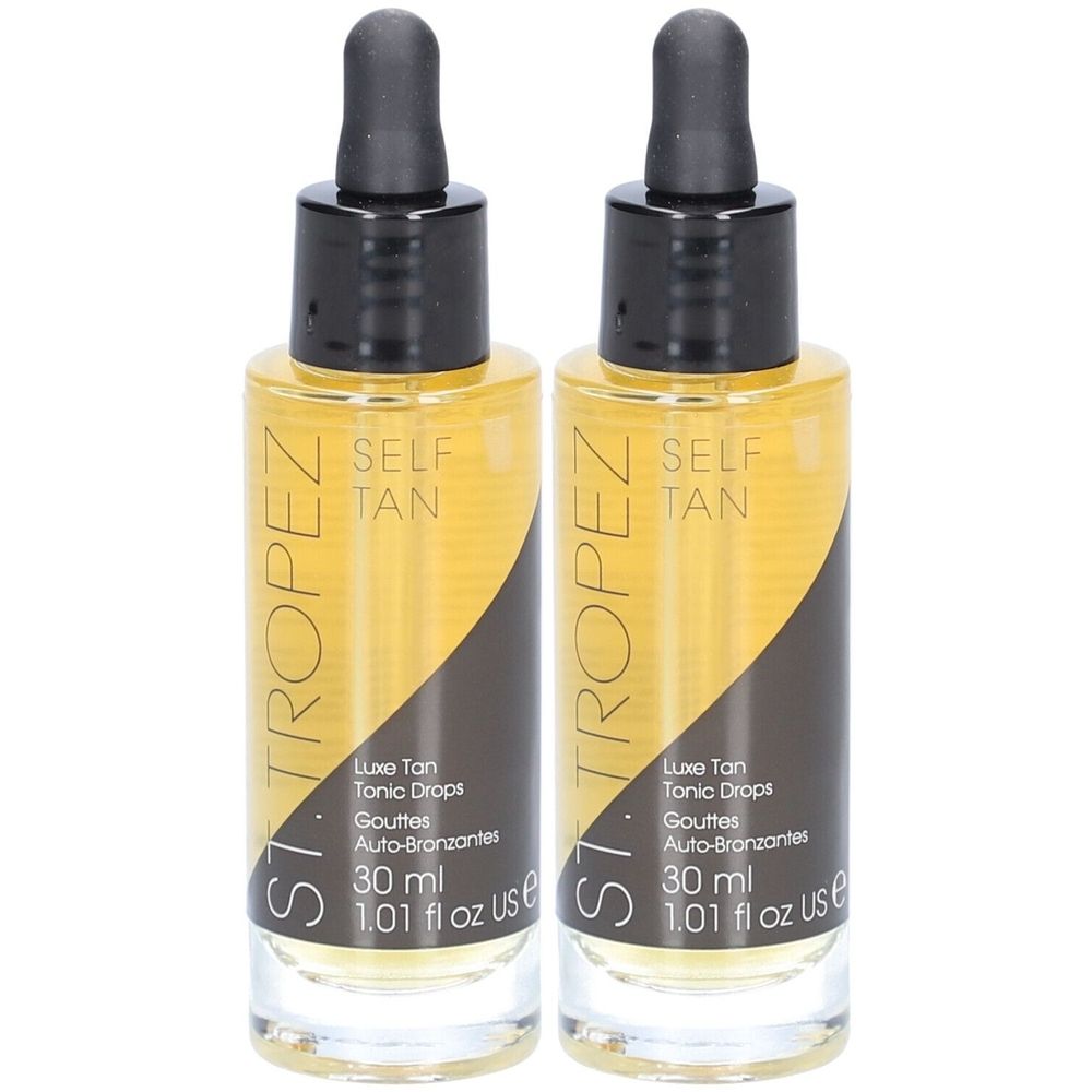 Deux flacons de liquide ambré avec bouchons noirs et pipettes. Inscription : ST. TROPEZ, SELF TAN, 30 ml.