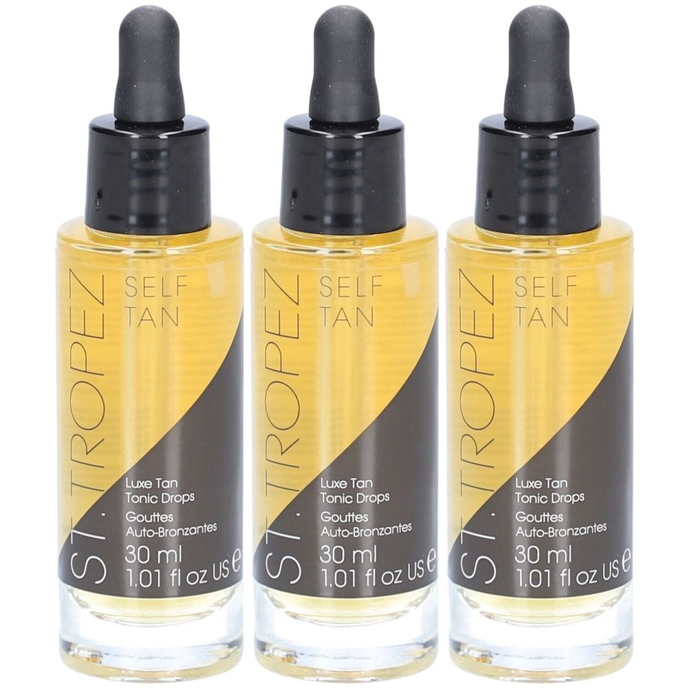 Trois flacons de liquide brun avec bouchons noirs et pipettes. Inscription : ST. TROPEZ, SELF TAN, Luxe Tan Tonic Drops, 30 ml.