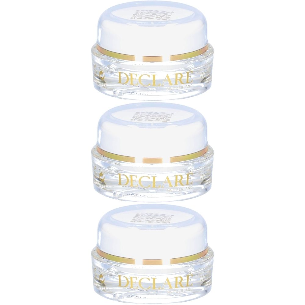 Trois pots de crème avec couvercles blancs et bord doré. Le mot DECLARE est visible sur les pots.