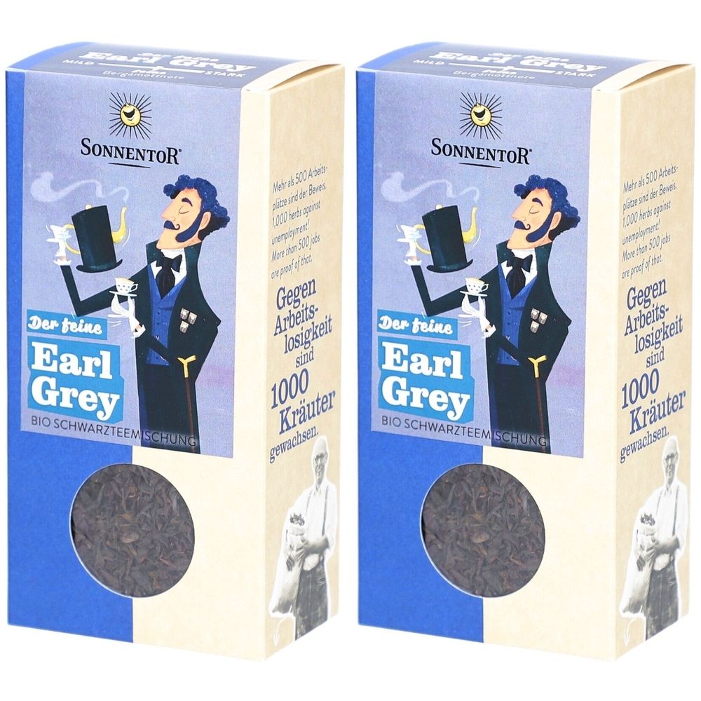 Zwei Kartons Earl Grey Tee. Aufdruck: SONNENTOR, Illustration eines Mannes mit Zylinder. Text: Earl Grey, 1000 Kräuter.