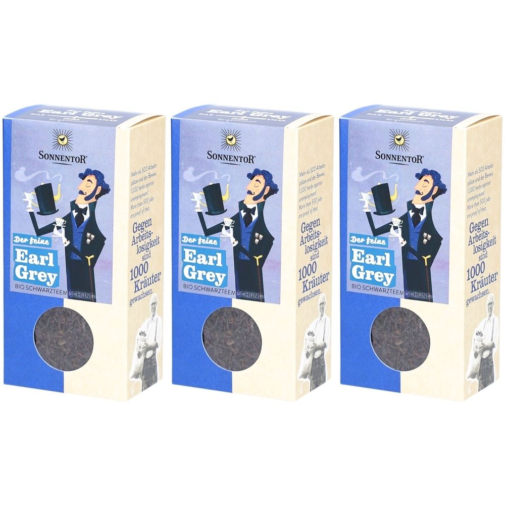 Drei Kartons mit Earl Grey Tee. Blaue und beige Verpackung mit Logo und Text. Sichtbar: Marke SONNENTOR, Earl Grey.
