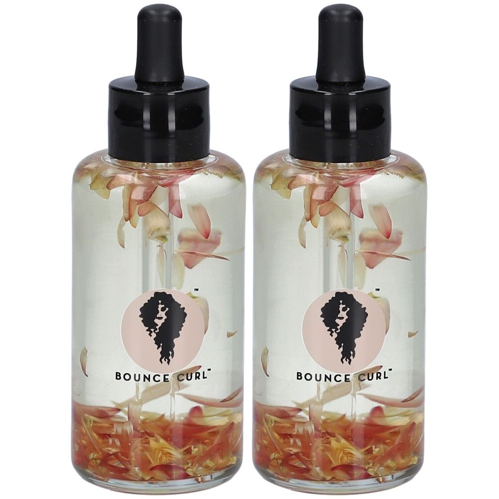 Deux flacons avec bouchon noir et pipette. Liquide clair avec pétales. Autocollant avec logo et texte: BOUNCE CURL.