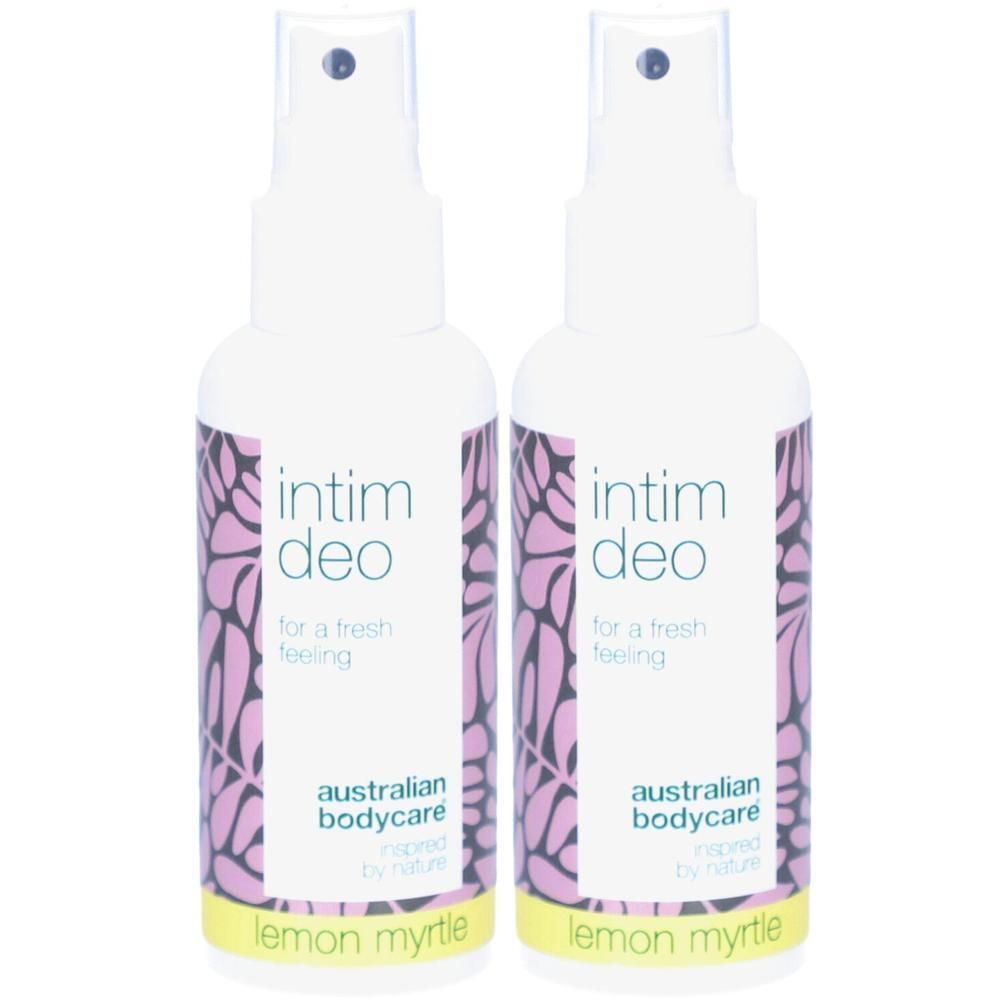 Deux flacons vaporisateurs blancs avec étiquettes. Inscription : intim deo, Lemon Myrtle. Motif floral.