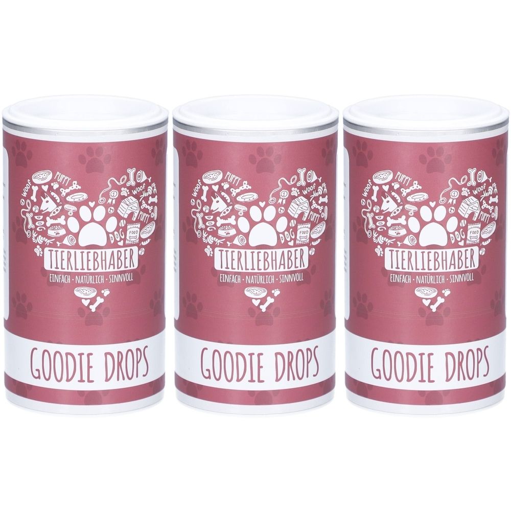 Drei zylindrische Behälter mit weißem Deckel. Aufdruck: Herz mit Pfoten, Knochen und Schriftzug. Unterhalb: GOODIE DROPS.