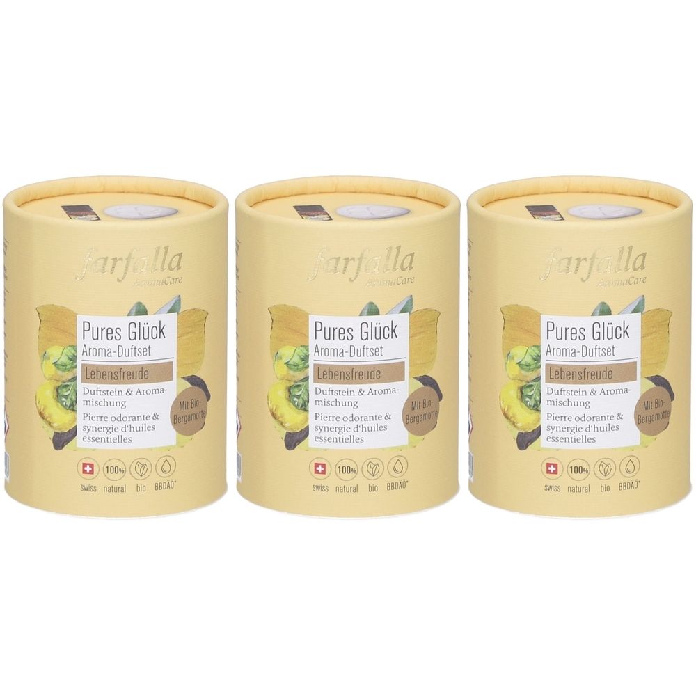 Drei zylindrische Behälter mit Deckel. Aufdruck: Pures Glück Aroma-Duftset, Lebensfreude. Logo und Text in Deutsch und Französisch. Schweizer Qualität.
