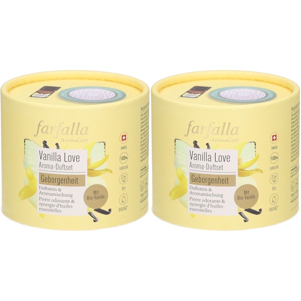 Zwei zylindrische Behälter, gelb mit Aufschrift. Aufschrift: Farfalla, Vanilla Love Aroma-Duftset, Geborgenheit. Mit Bio-Vanille.